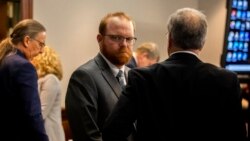 Travis McMichael looks back at his mother and sister in the courtroom after the jury convicted him for the murder of Ahmaud Arbery, in the Glynn County Courthouse, Nov. 24, 2021, in Brunswick, Ga.