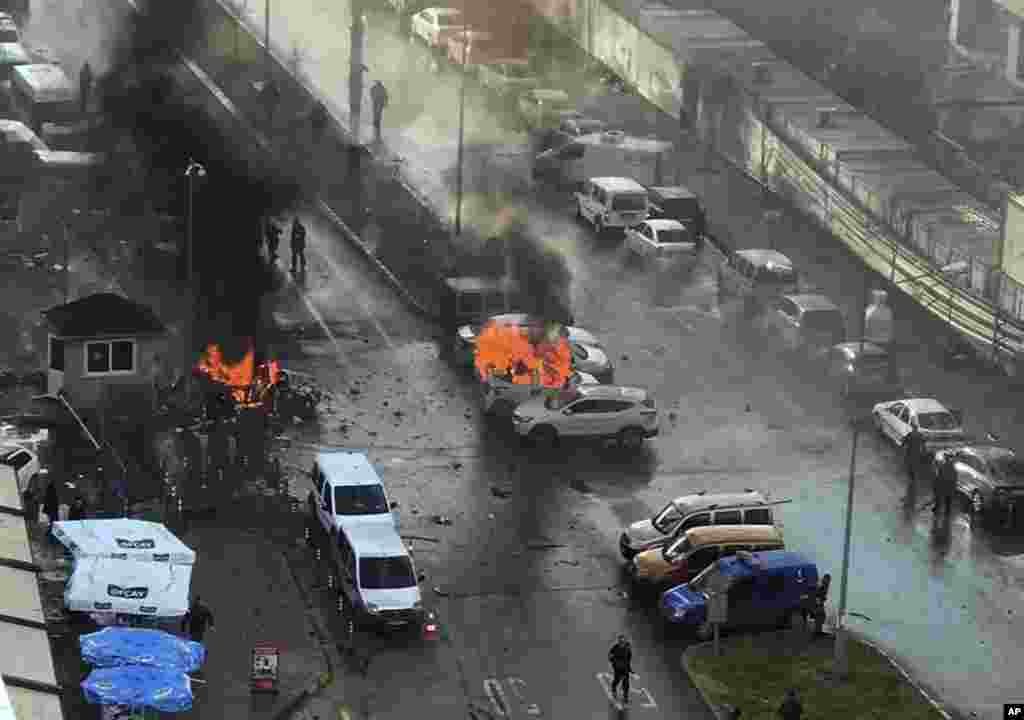 Cars burn after a car bomb explosion in Izmir, Turkey. An explosion believed to have been caused by a car bomb in front of a courthouse in the western Turkish city of Izmir, wounded several people, a local official said. Two of the suspected attackers were killed in an ensuing shootout with police.