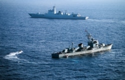 Crew members of China's South Sea Fleet take part in a drill in the Paracel Islands in the South China Sea on May 5, 2016.