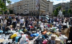 Macedonians collect humanitarian aid of food, hygienic products, clothing and bottled water intended for the flooded regions in Serbia and Bosnia-Herzegovina, in Skopje, Macedonia, May 18, 2014.