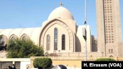 Riot police guard the Cathedral while they are blocking the streets leading the cathedral complex in Abassya, Cairo, Egypt, Dec. 11, 2016.