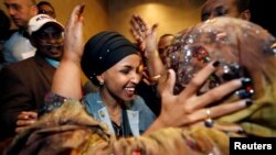 Democratic congressional candidate Ilhan Omar is greeted by her husband’s mother after appearing at her midterm election night party in Minneapolis, Minnesota, Nov. 6, 2018. 