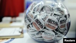 FILE - Buttons reading "Repeal Obamacare" are displayed at the Conservative Political Action Conference (CPAC) in Washington, Feb. 9, 2012. 