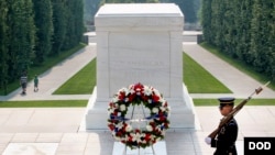 A Soldier with the 3rd Infantry Regiment guards the Tomb of the Unknown Soldier at Arlington National Cemetery.