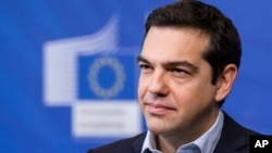 Greece's Prime Minister Alexis Tsipras addresses the media at the European Commission headquarters in Brussels, March 13, 2015. 