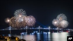 Fireworks light up the skies at the construction site of the Peljesac Bridge in Komarna, Croatia, Thursday, July 29, 2021. European Union-funded Peljesac Bridge in southern Croatia that has been built by a Chinese state-owned company.