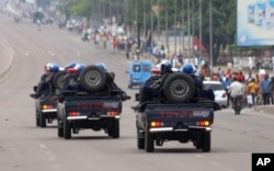 Congo riot police patrol streets on trucks, after violence erupted due to the delay of the presidential elections in Kinshasa, Democratic Republic of Congo, Sept. 20, 2016.