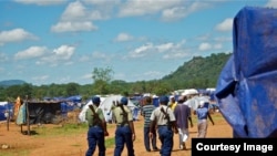 Zimbabwean police on patrol at the Chingwizi transit camp for over 20,000 people displaced as a result of the flooded Tokwe-Mukorsi Dam. (Photo: Human Rights Watch)