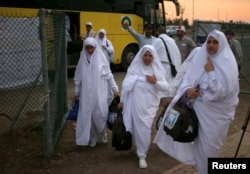 Iranian pilgrims arrive for the annual haj pilgrimage in Arafat outside the holy city of Mecca, Saudi Arabia, Aug. 30, 2017.