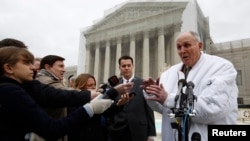 Indiana soybean farmer Vernon Bowman speaks to the media outside the Supreme Court in Washington, Feb. 19, 2013. 