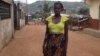 Isatu Gbankay, six months pregnant, stands outside a friend's home in Freetown, Sierra Leone, April 8, 2015. (Nina deVries/VOA)