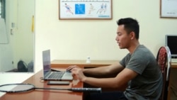 In this March 19, 2020, photo, a physical education teacher talks with his students during an online class at Nguyen Tat Thanh school in Hanoi, Vietnam.