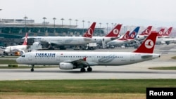 FILE - A Turkish Airlines plane prepares to take off at Ataturk International Airport in Istanbul, May 15, 2013. 