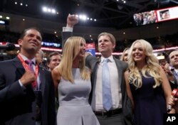 Republican Presidential Candidate Donald Trump's children Donald Trump, Jr., Ivanka Trump, Eric Trump AND Tiffany Trump celebrate on the convention floor during the second day session of the Republican National Convention in Cleveland, July 19, 2016.