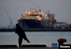 FILE - A membrane-type liquefied natural gas (LNG) tanker is moored at a thermal power station in Futtsu, east of Tokyo, Feb. 8, 2017.