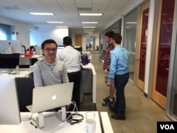 Software engineer Mok Sophal, 31, works at his desk at Target’s online sales team office in Sunnyvale, CA, on September 1, 2016. (Sophat Soeung/VOA Khmer)