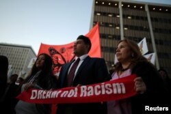 FILE - People protest for immigration reform for DACA recipients and a new DREAM Act, in Los Angeles, Jan. 22, 2018.