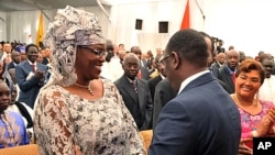 This handout photo shows Senegal's new president Macky Sall (R) greeting his wife Mareme Faye Sall, after the swearing-in ceremony Dakar on April 2, 2012.