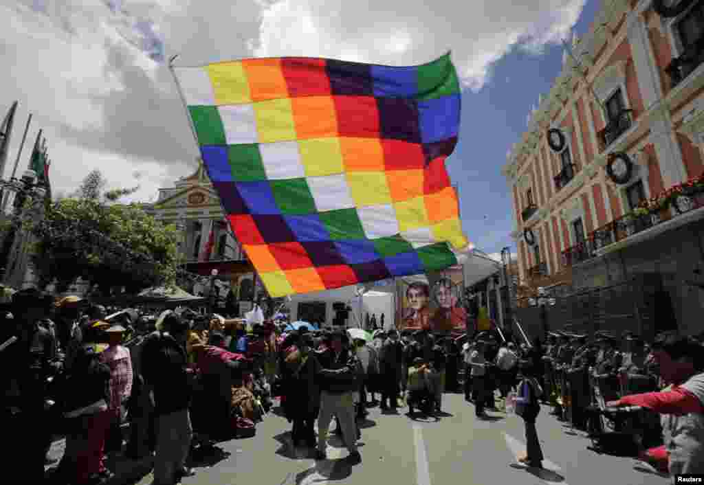 Supporters of Bolivia&#39;s President Evo Morales celebrate the launch of the Tupac Katari satellite, in La Paz. China Great Wall Industry Corporation launched Bolivia&#39;s first communications satellite, local media reported.