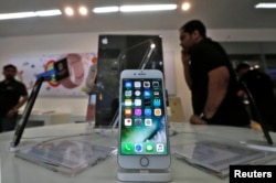 An iPhone is seen on display at a kiosk at an Apple reseller store in Mumbai, India, Jan. 12, 2017.