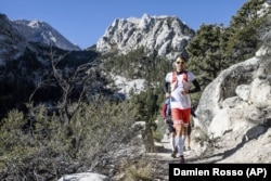 Professional trail runner Francois D’haene running on the John Muir Trail in the California Sierra Nevada mountain range.