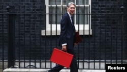 Britain's Chancellor of the Exchequer Phillip Hammond arrives in Downing Street in London, Britain, Sept. 7, 2016.