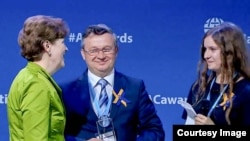 Rector Roman Gryniuk accepts the 2015 Atlantic Council Freedom Award