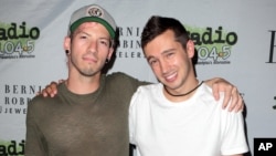 Josh Dun, left, and Tyler Joseph of the band Twenty One Pilots pose for photographers backstage during the Radio 104.5 9th Birthday Show at BB&T Pavilion, June 11, 2016, in Camden, New Jersey.