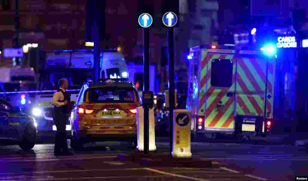 Police say that late Saturday a vehicle mowed down pedestrians on London Bridge and men with large knives stabbing passersby at nearby Borough Market, June 3, 2017.