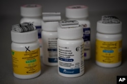 Bottles of several opioid based medication at a pharmacy in Portsmouth, Ohio, June 21, 2017.