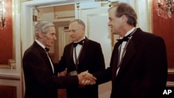 FILE - In this Nov. 16, 1994, photo, The National Book Awards prize winning writers, William Gaddis (L), Sherwin B. Nuland (C), and James Tate greet each other after the awards ceremony in New York.