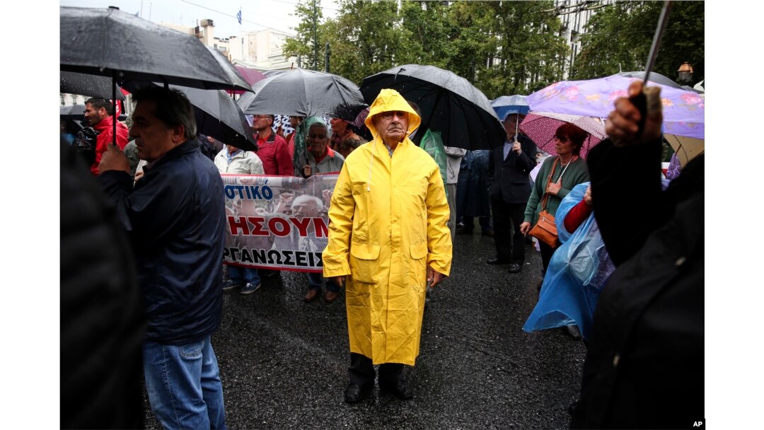 Greek pensioners take part in an anti-austerity rally, in Athens, May 18, 2017. New belt-tightening measures will be imposed beyond the end of Greece's third bailout next year, including pension cuts and tax hikes.