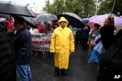 Greek pensioners take part in an anti-austerity rally, in Athens, May 18, 2017. New belt-tightening measures will be imposed beyond the end of Greece's third bailout next year, including pension cuts and tax hikes.