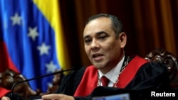 FILE - Venezuela's Supreme Court President Maikel Moreno, shown reading a statement in Caracas, Venezuela, Aug. 1, 2017, is one of the officials targeted with the latest round of EU sanctions. 