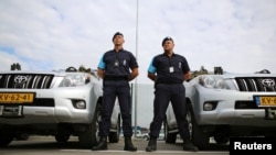 Border police from the Netherlands stand in front of their vehicles during the official launch of the European Union's Border and Coast Guard Agency at a border crossing on the Bulgarian-Turkish border in Kapitan Andreevo, Bulgaria, October 6, 2016. 