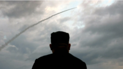 : North Korean leader Kim Jong Un watches the launch of a ballistic missile at an unknown location in North Korea on July 31, 2019, in this screen grab image taken from North Korean broadcaster KCTV.