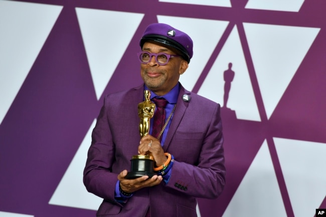 FILE - Spike Lee poses with the award for best adapted screenplay for "BlacKkKlansman" in the press room at the Oscars on Sunday, Feb. 24, 2019, at the Dolby Theatre in Los Angeles. (Photo by Jordan Strauss/Invision/AP)