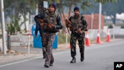 FILE - Indian security forces patrol inside the Indian air force base that came under attack Saturday in Pathankot, India, Jan. 3, 2016.