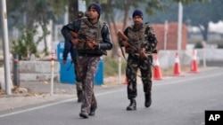 Indian security forces patrol inside the Indian air force base that came under attack Saturday in Pathankot, India, Jan. 3, 2016.