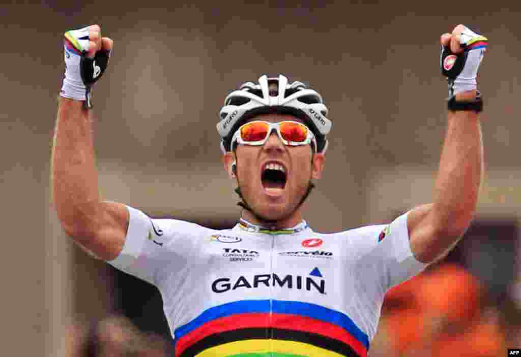 July 14: Thor Hushovd of Norway crosses the finish line to win the 13th stage of the Tour de France cycling race. (AP Photo/Laurent Rebours)