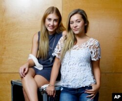 Maddie Marlow, left, and Tae Dye, of Maddie & Tae, pose for a portrait at Love Shack Studio in Nashvile, Tennessee, Aug. 27, 2015.