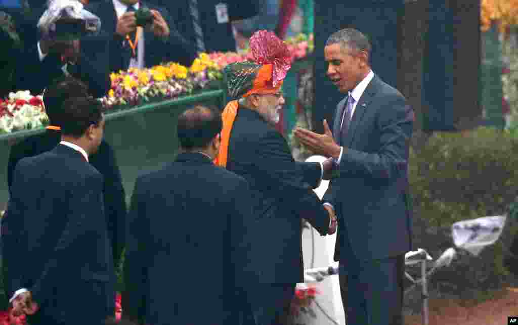 President Barack Obama shakes hand with Indian Prime Minister Narendra Modi as he arrives to preside over India’s annual Republic Day parade in New Delhi, India, Monday, Jan. 26, 2015.