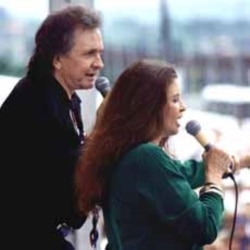 Country music legend Johnny Cash performs with his wife June Carter Cash, a member of the famous Carter Family.