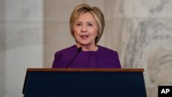 Former Secretary of State Hillary Clinton speaks during a ceremony to unveil a portrait of Senate Minority Leader Harry Reid, D-Nev., on Capitol Hill, Dec. 8, 2016, in Washington.