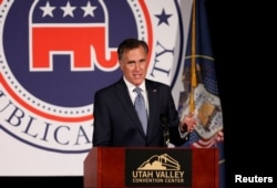 FILE - Former U.S. presidential candidate Mitt Romney speaks at the Utah County Republican Party Lincoln Day Dinner, in Provo, Utah, Feb. 16, 2018.
