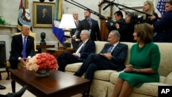 President Donald Trump speaks to, from left, Senate Majority Leader Mitch McConnell, Senate Minority Leader Chuck Schumer, and House Minority Leader Nancy Pelosi, in the Oval Office of the White House, Sept. 6, 2017.