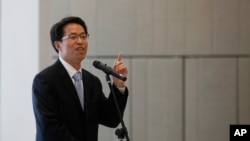 FILE - Beijing's top representative in Hong Kong, Zhang Xiaoming, in Hong Kong, July 16, 2013.
