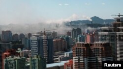 Smoke rises from a chimney in downtown Pyongyang, North Korea, September 7, 2018. Picture taken September 7, 2018. 