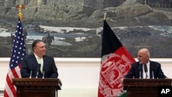 Afghan President Ashraf Ghani, right, speaks after a meeting with U.S. Secretary of State Mike Pompeo, at the presidential palace in Kabul, July 9, 2018. Pompeo used a surprise trip to step up the Trump administration's calls for peace talks between Afghanistan and the Taliban.