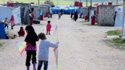 Children of foreign fighters play in the al-Roj camp in Syria, March 1, 2019. (H. Murdock/VOA)